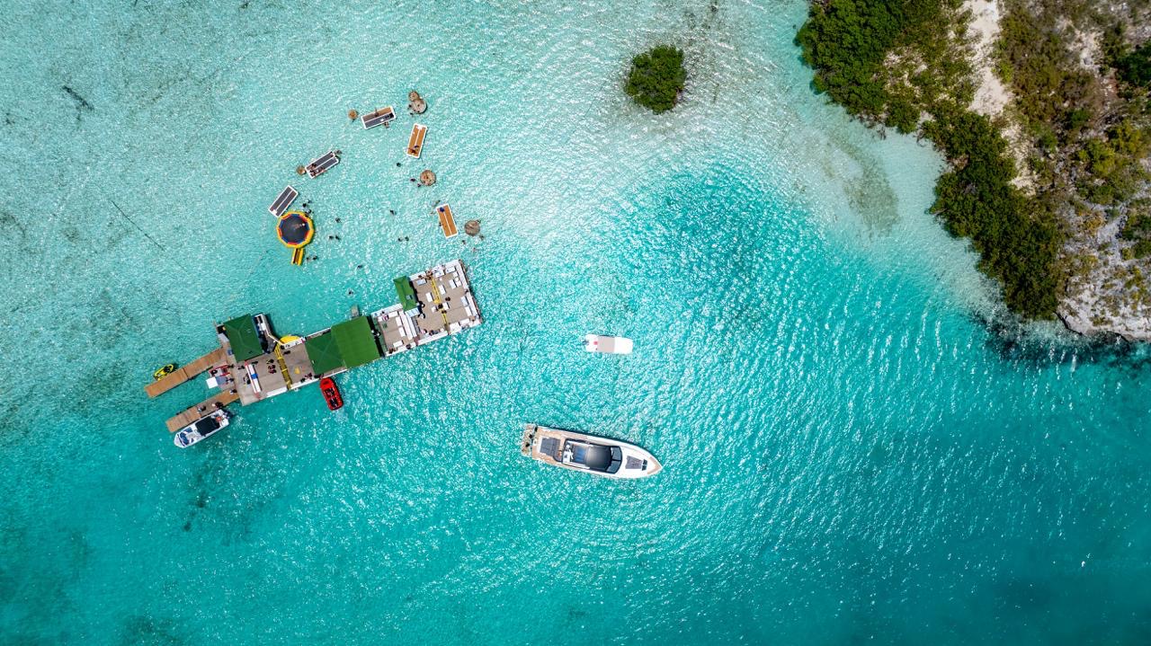 Aerial drone shot of Pure Energy yacht charter at Noah's Ark Tiki Bar, Turks and Caicos
